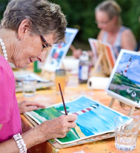 Senior woman painting