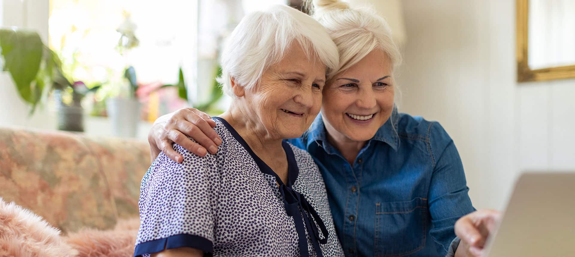 Mother and daughter researching memory care options