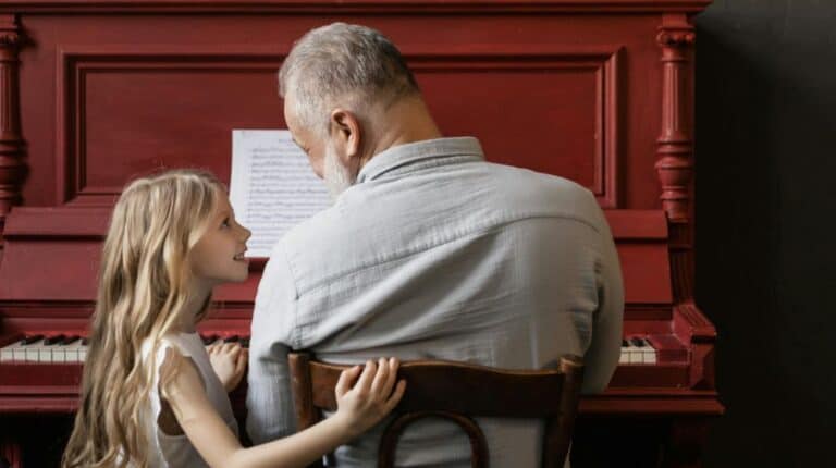 Grandfather and Granddaughter Playing the Piano