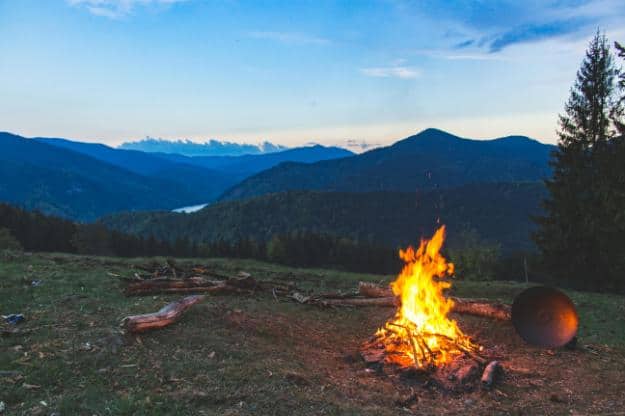 Bonfire Surrounded With Green Grass Field | camping for seniors px