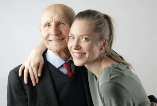 Delighted senior father and adult daughter hugging in studio | how to deal with irrational elderly parents px