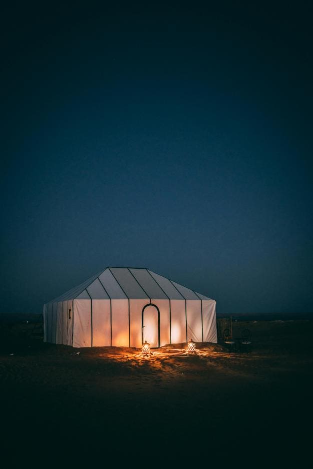 White Tent on Brown Sand during Night Time | camping for seniors px