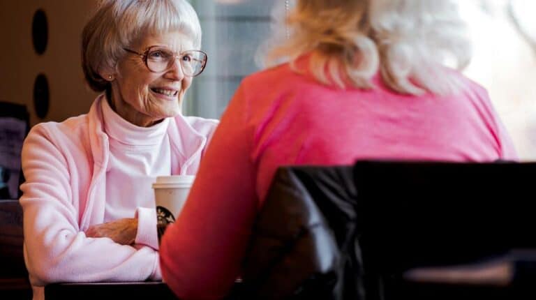 senior votes | Photo of Old Woman Sitting While Talking With Another Woman